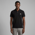 Nigerian man wearing black emblem-detail zip-neck polo