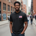 Young Nigerian male model wearing black flag patch polo shirt