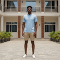 Young Nigerian male model wearing sky blue eagle logo polo shirt