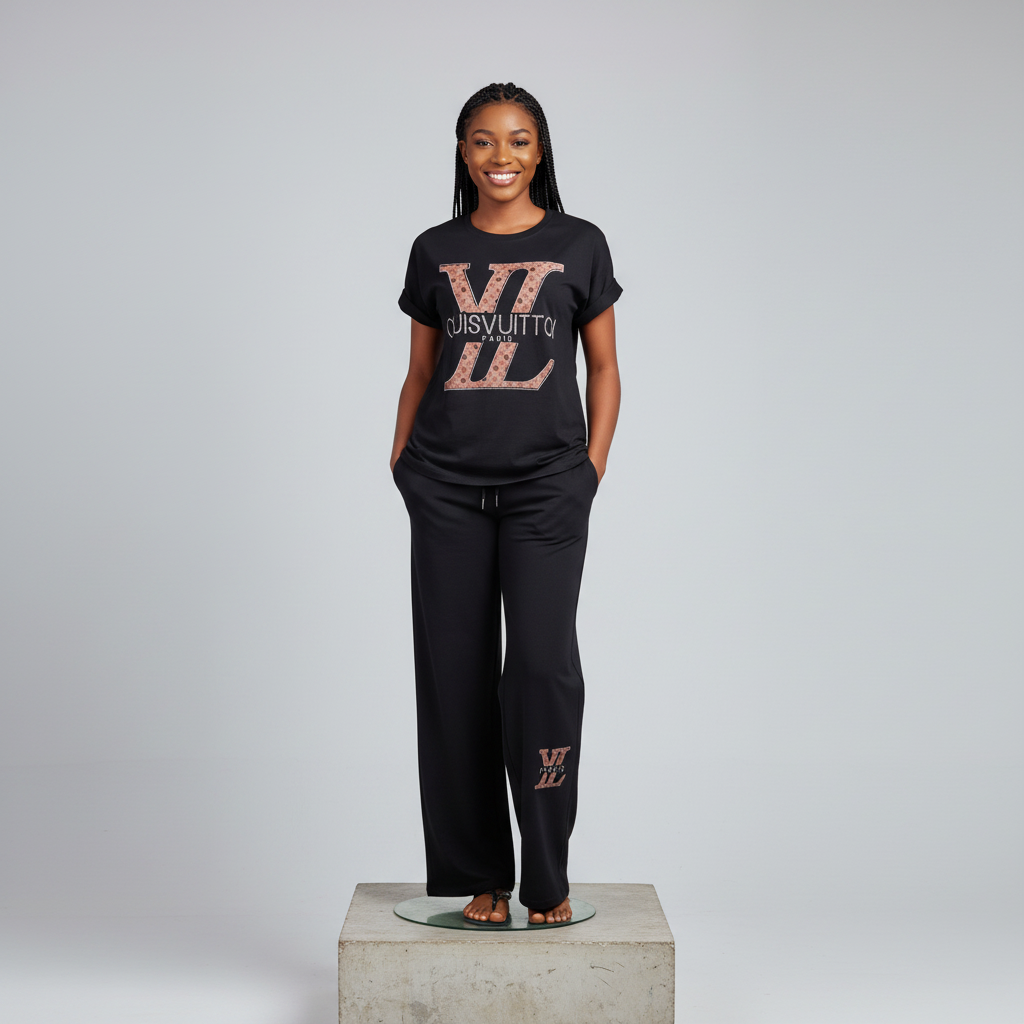Nigerian female model wearing Black Monogram Print Co-ord Tracksuit Set - front view