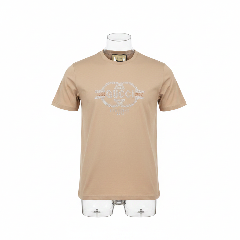 Ghost mannequin front view of beige rhinestone circular emblem T-shirt