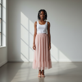 Nigerian teenage girl wearing blush pink pearl tulle midi skirt