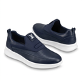Pair of navy textured slip-on shoes with white soles on white catalogue background