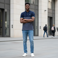 Young Nigerian male model wearing navy striped polo shirt