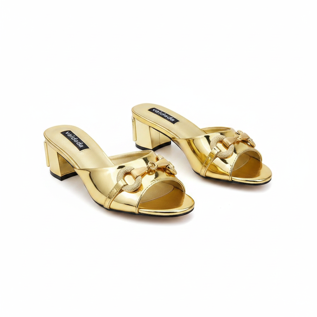 Ghost mannequin pair view of gold metallic horsebit chain block heel mules