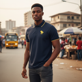 Young Nigerian male model wearing navy polo with gold horse embroidery