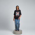 Nigerian female model front view - black graphic top and blue denim striped jeans set