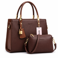 Structured brown handbag with matching small bag on white background