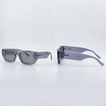 Front and side views of chunky translucent smoke-grey rectangular glasses