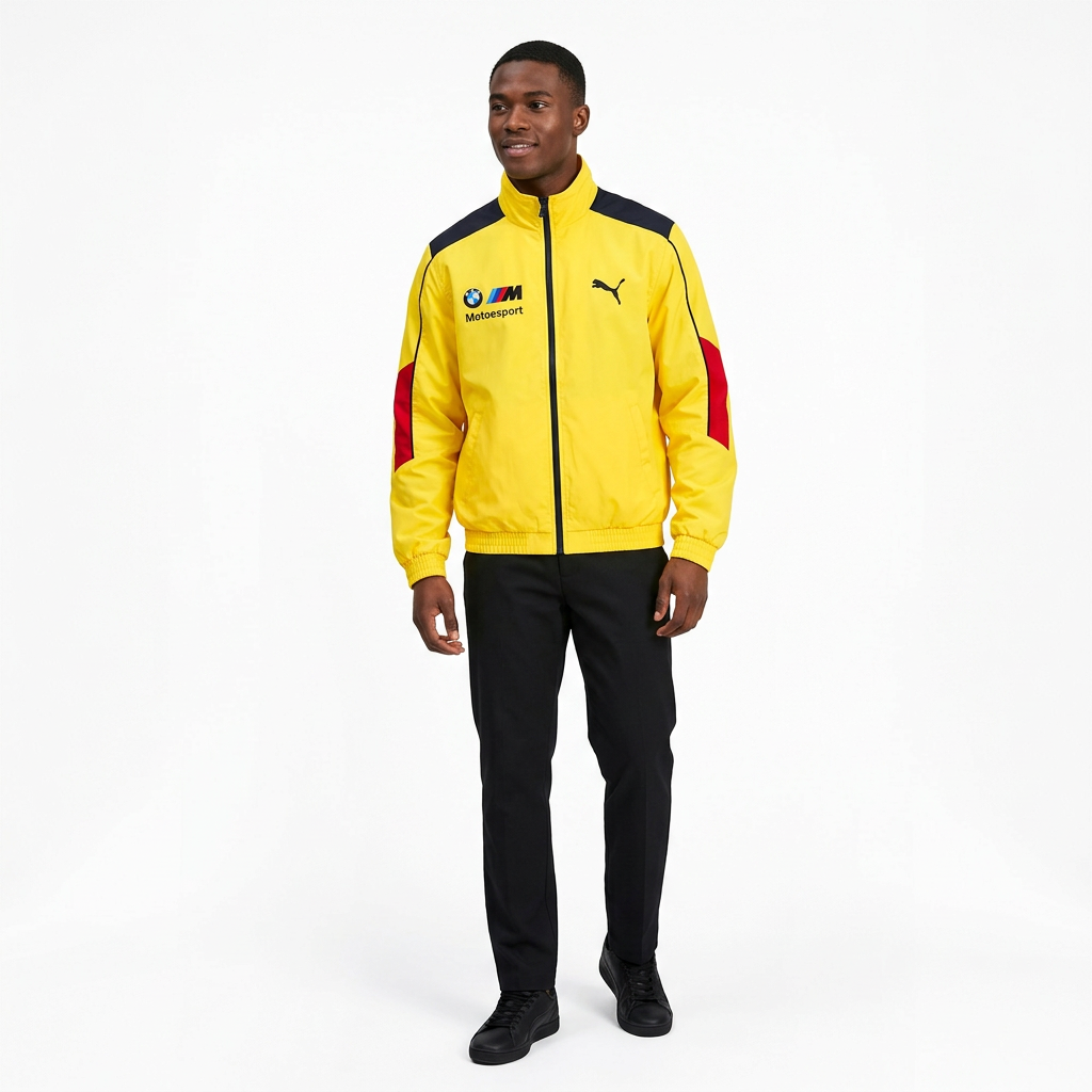 Nigerian male model wearing yellow colour-block track jacket against white