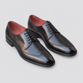 Pair of black men's lace-up shoes with wingtip detailing