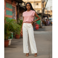 Young Nigerian female wearing pink rhinestone bow knit vest top