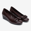 Matching burgundy-brown glossy sculpted-bow wedge shoes