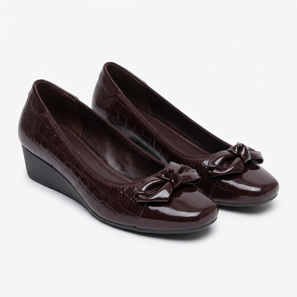 Matching burgundy-brown glossy sculpted-bow wedge shoes