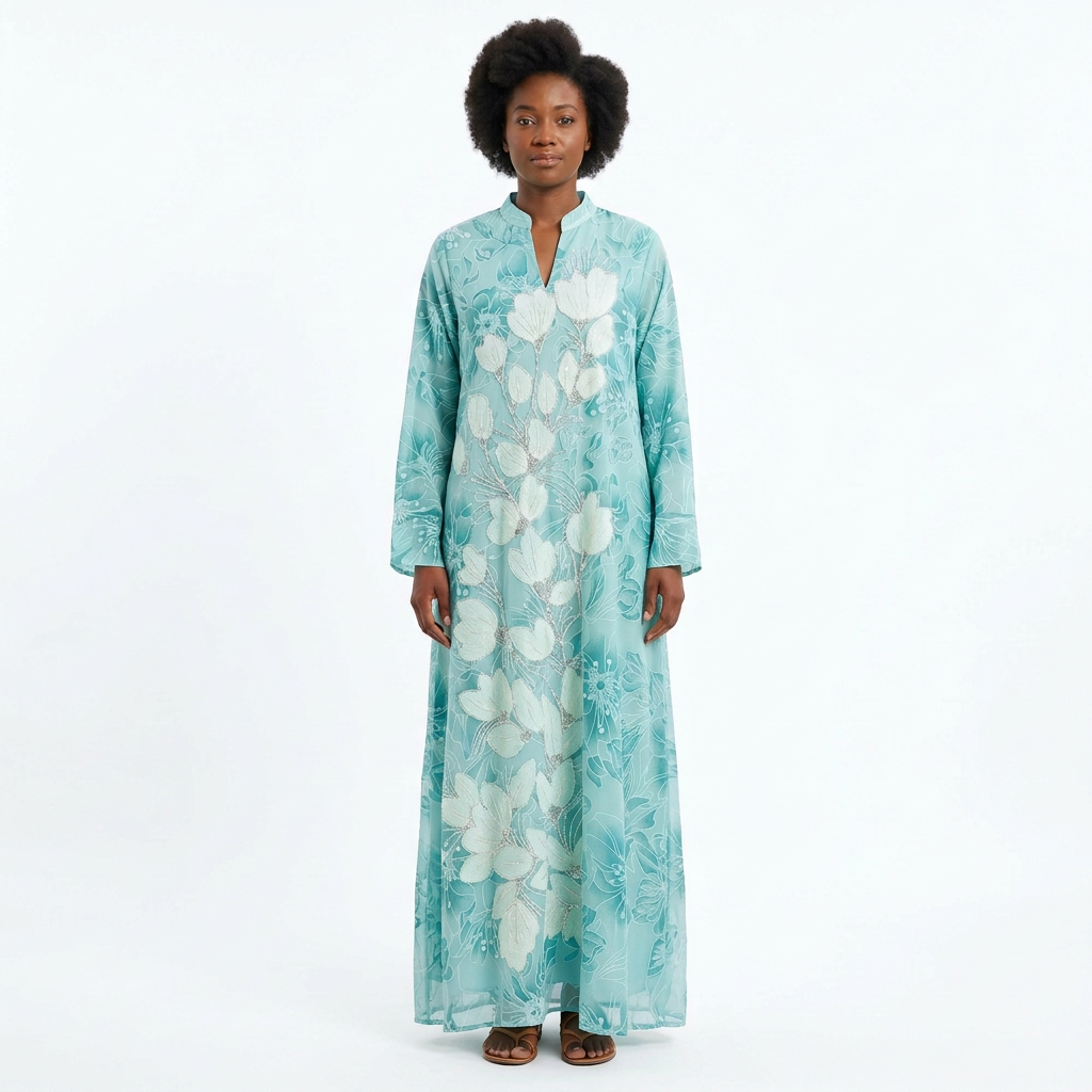 Woman wearing mint botanical abaya with narrow open neckline