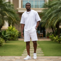 Nigerian male model wearing white matching co-ord set outdoors