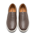 Pair of brown slip-on shoes with stitched apron toes and white soles