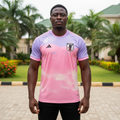 Nigerian male model wearing lavender and pink sunset gradient football jersey front view