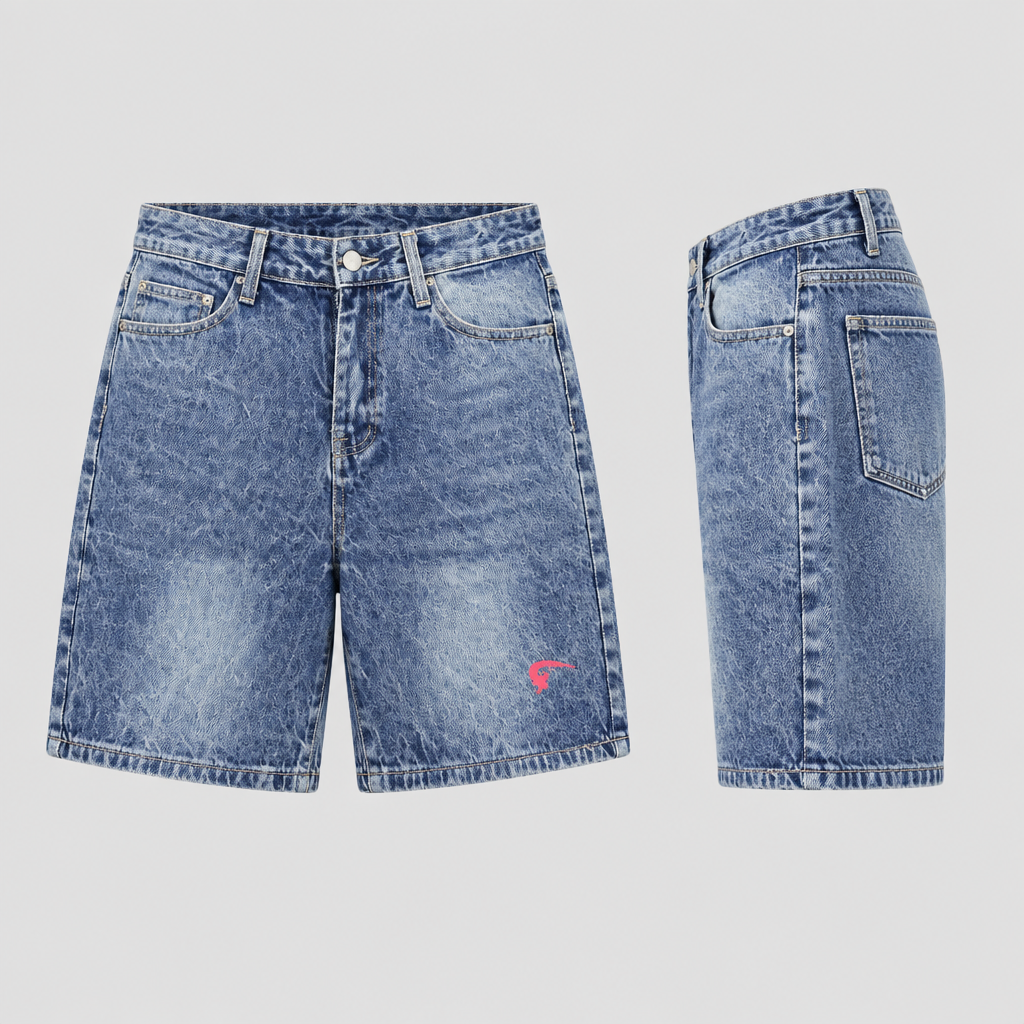 Washed blue denim shorts with faded legs and small pink detail near the hem