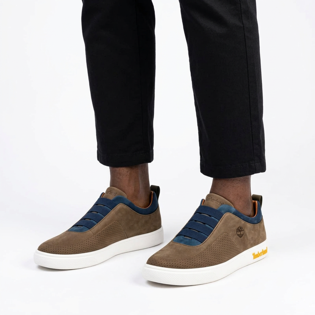 Brown navy-trim elastic-band sneakers properly worn on both feet