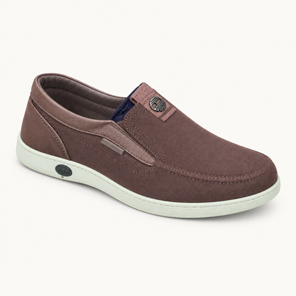 Brown slip-on shoe with a light sole on a plain background