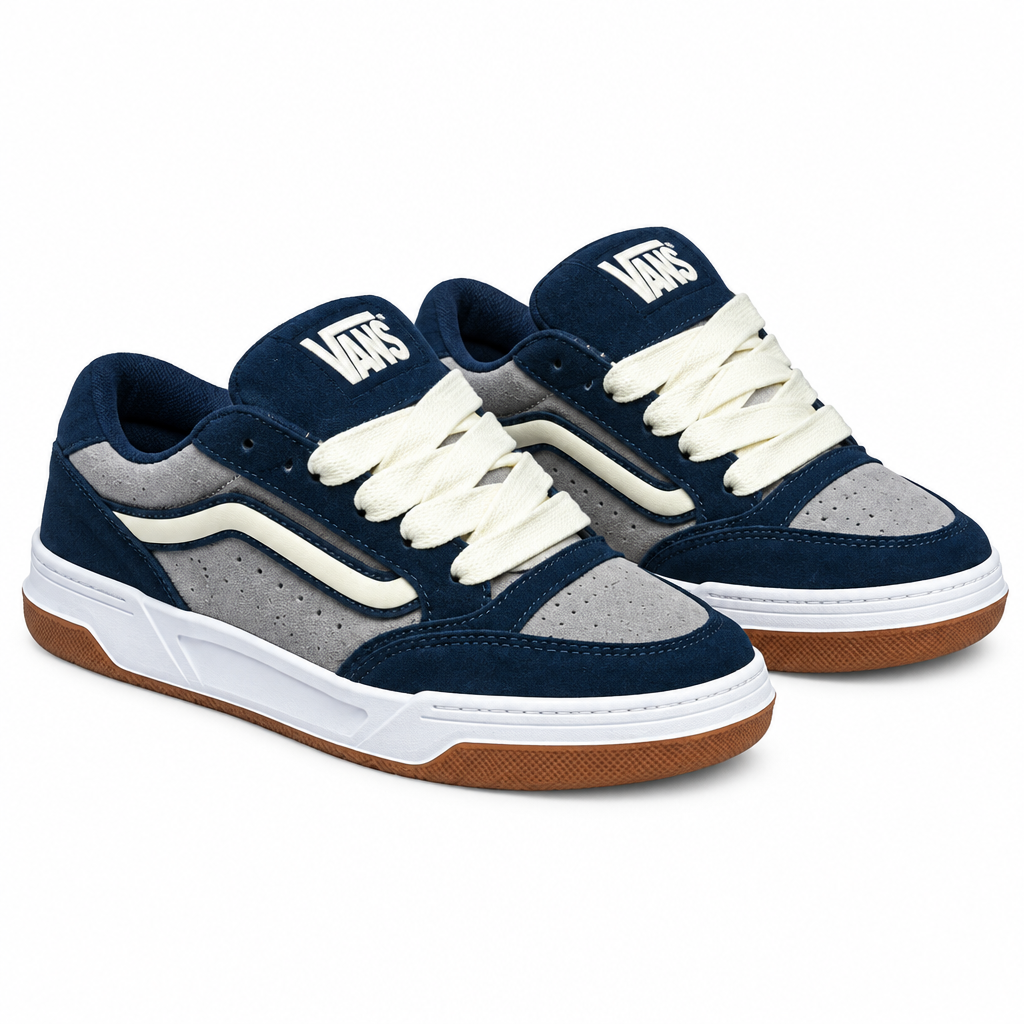 Pair of navy-grey panelled gum-sole sneakers on white background