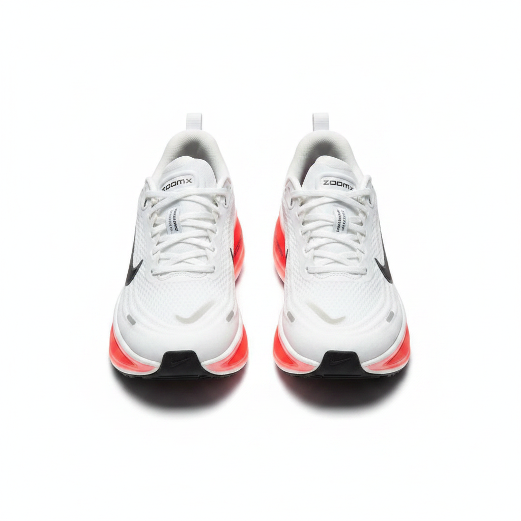 Pair of ZOOMX white sneakers with red soles shown in worn shape with no visible feet