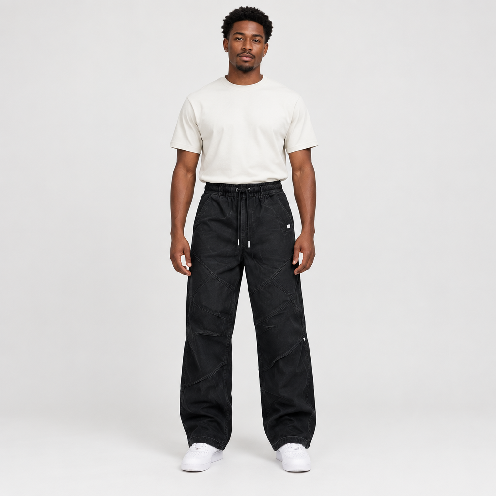 Black panelled drawstring trousers worn by a Black adult male model