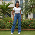 Women's blue denim wide-leg flare jeans — Nigerian female model shot