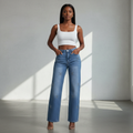 Nigerian female model wearing light blue rhinestone monogram wide-leg jeans front view