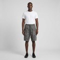 Full-body male model wearing charcoal grey panelled shorts