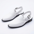 White closed-toe slingback shoes with buckle straps and black low heels