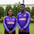Nigerian female and male models wearing the purple long-sleeve retro football jersey with striped sleeves