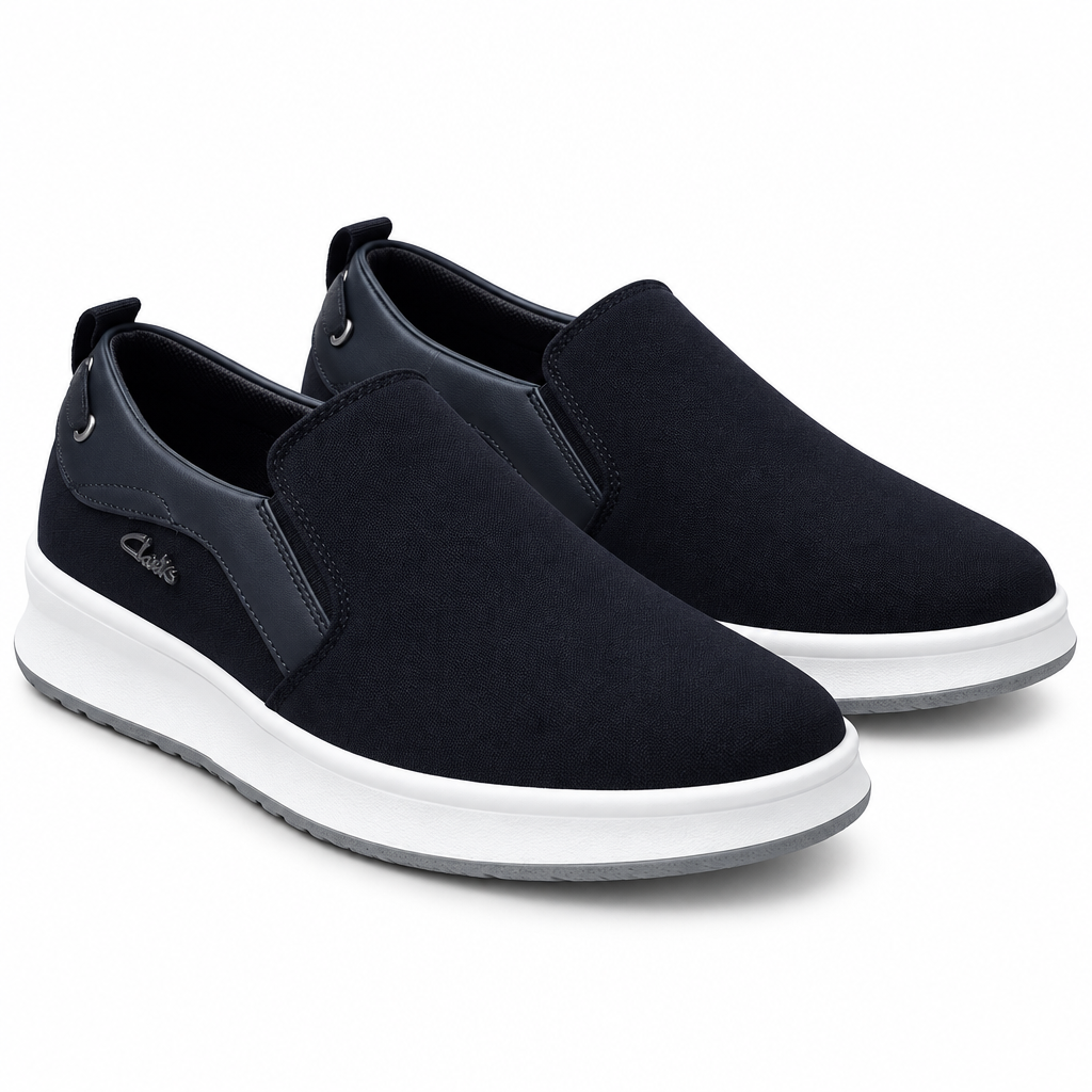 Pair of dark navy slip-on sneakers with white midsoles on white