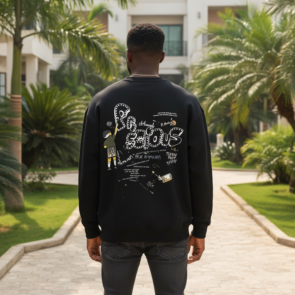 Nigerian male model wearing black sweatshirt with bubble letter cartoon back graphic – back view