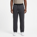 Adult Black model wearing charcoal grey straight-leg joggers with matching dark drawstrings