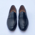 Straight-on black perforated loafers with plain front straps