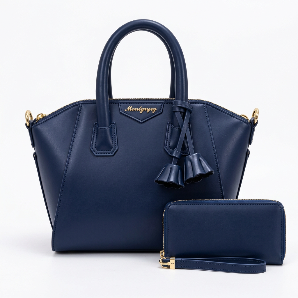 Navy twin-handle handbag with tassel details pictured with matching zip wristlet