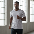 Nike Breathe platinum short-sleeve athletic T-shirt on male model