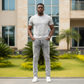 Nigerian male model wearing Men's Grey Silver Acid-Washed Slim Denim Jeans Marbled Wash