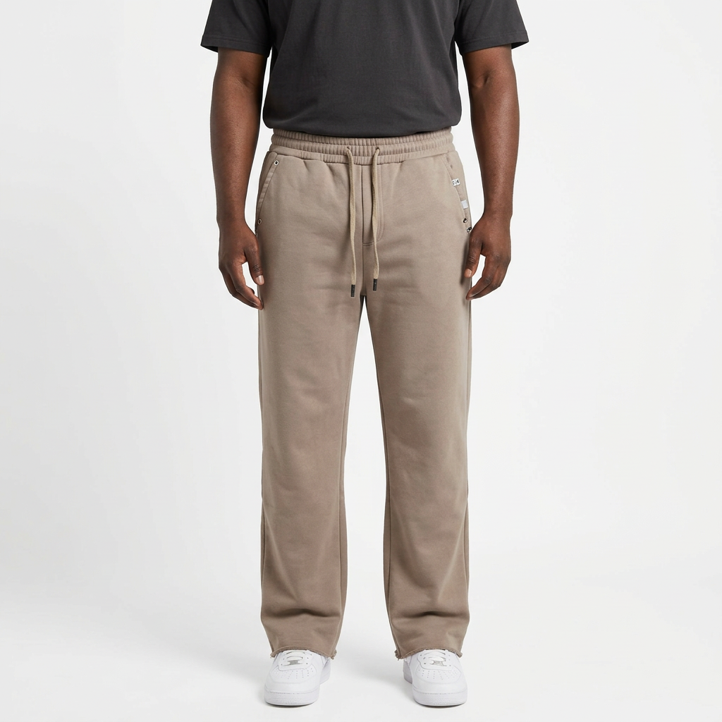 Adult Black model wearing taupe beige straight-leg drawstring joggers