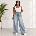 Young Black Nigerian woman wearing faded blue washed wide-leg denim jeans
