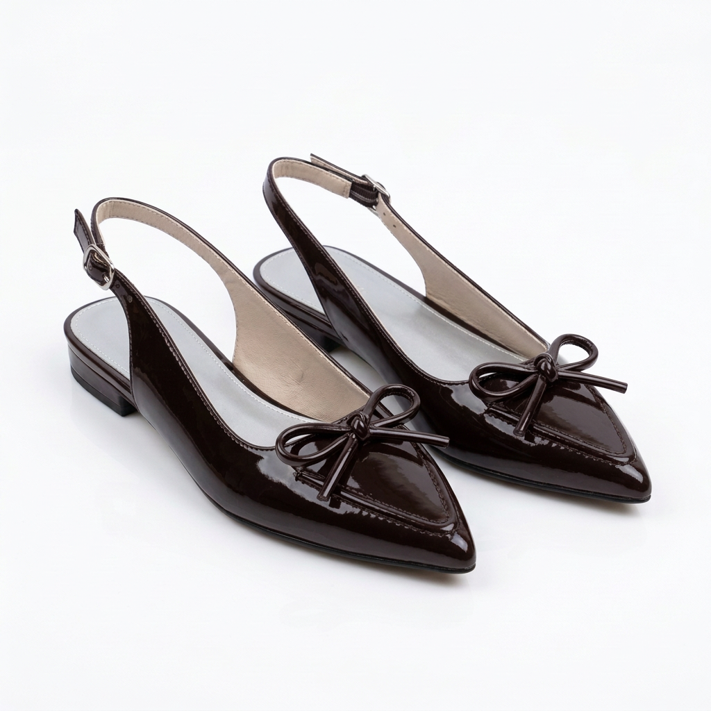Pair of glossy coffee-brown bow slingbacks on white background