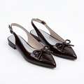 Pair of glossy coffee-brown bow slingbacks on white background