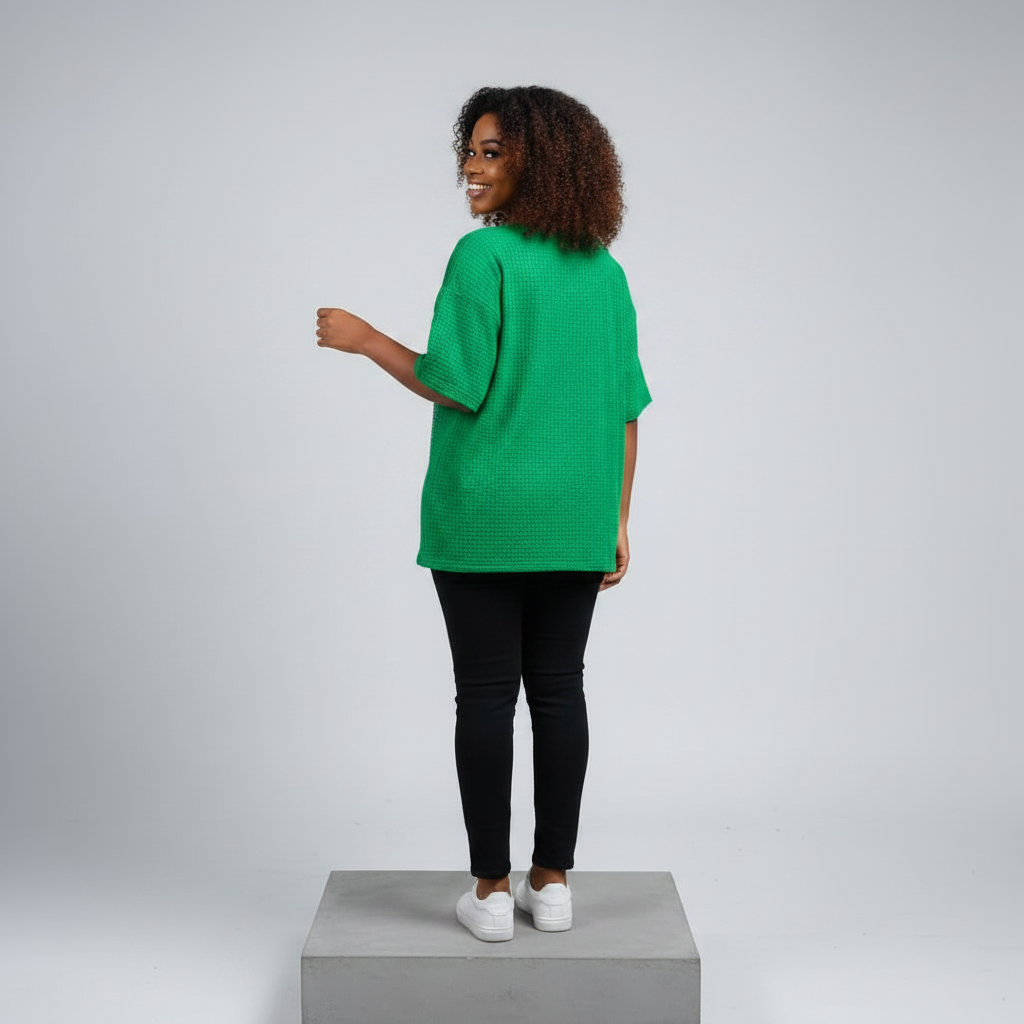 Nigerian female model back view - green rhinestone butterfly graphic top