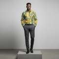 Nigerian male model wearing yellow abstract print long-sleeved shirt, front view