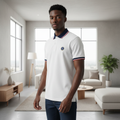 Young Nigerian male model wearing white navy-tipped polo shirt, three-quarter pose