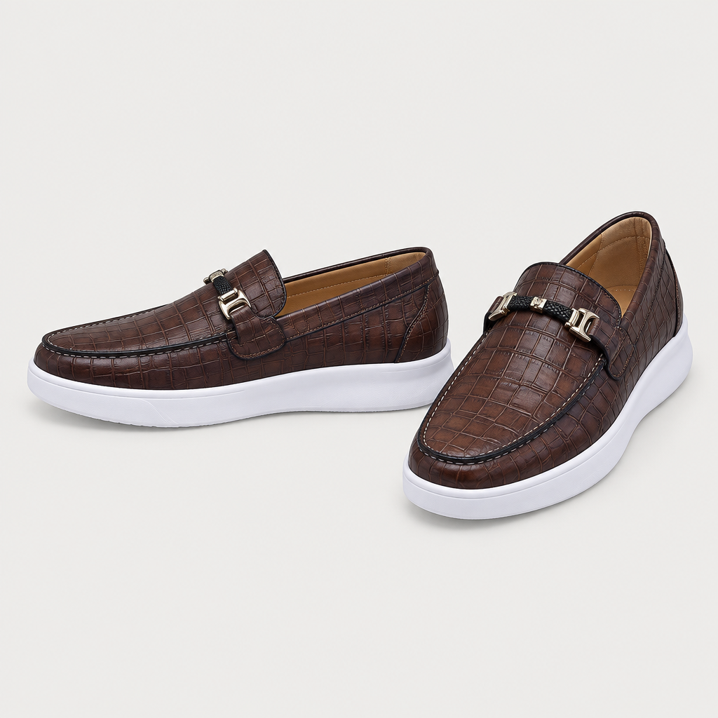Dark brown embossed slip-on loafers with gold-tone vamp hardware