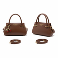 Brown leather mini handbag ghost mannequin front and side view with red cherry charm and crossbody strap