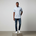 Nigerian male model wearing light blue plaid short-sleeved shirt